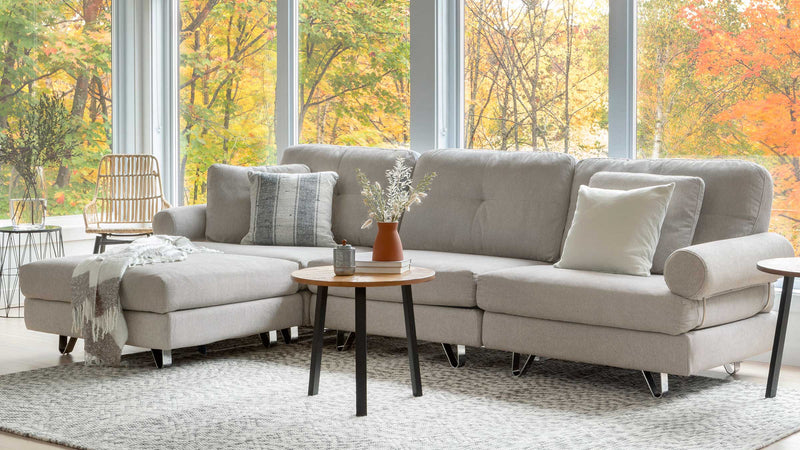 A light coloured modular sofa in a well light room.