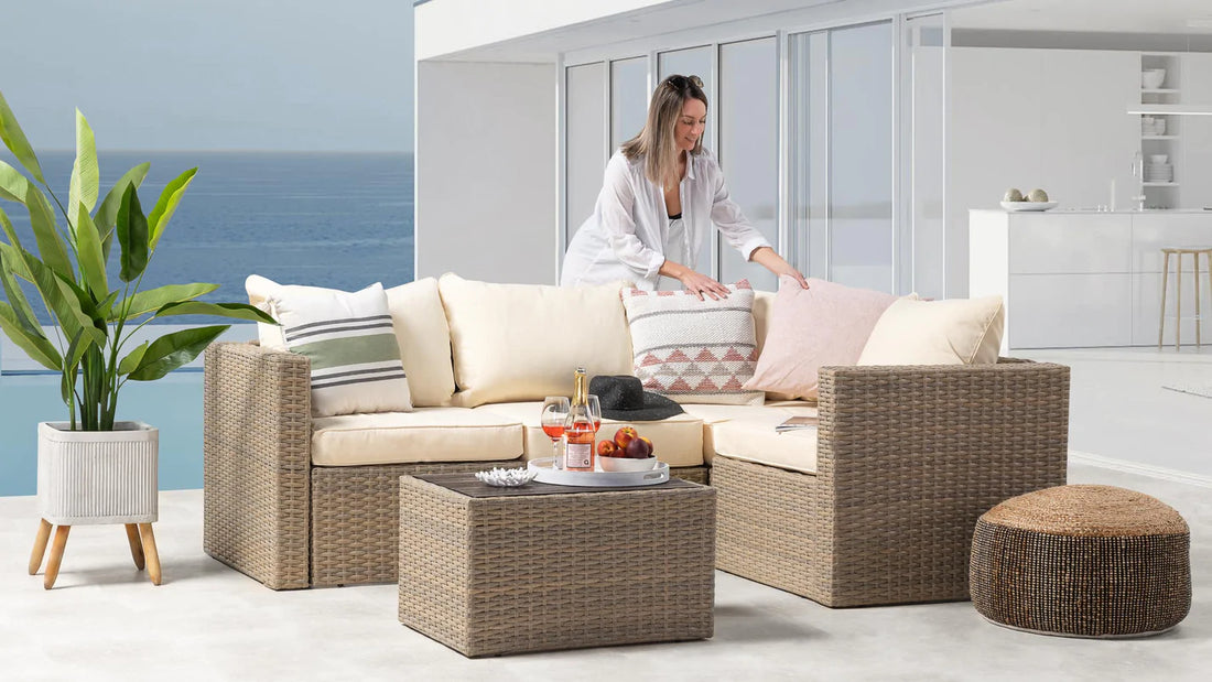A lady standing by modern patio furniture.
